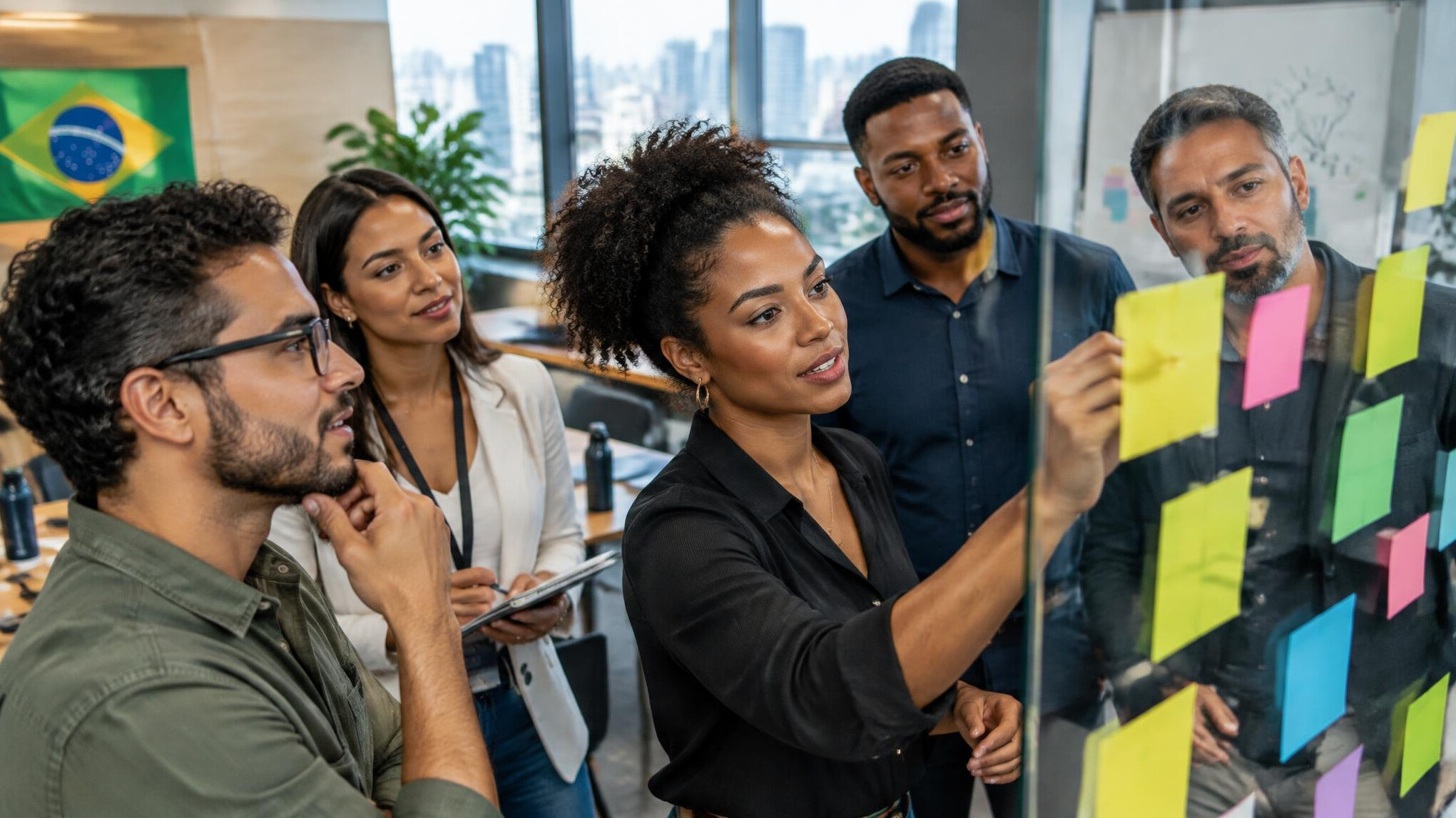 Team meeting with sticky notes on glass wall